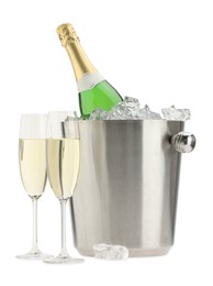 Champagne in glasses and ice bucket with bottle isolated on white