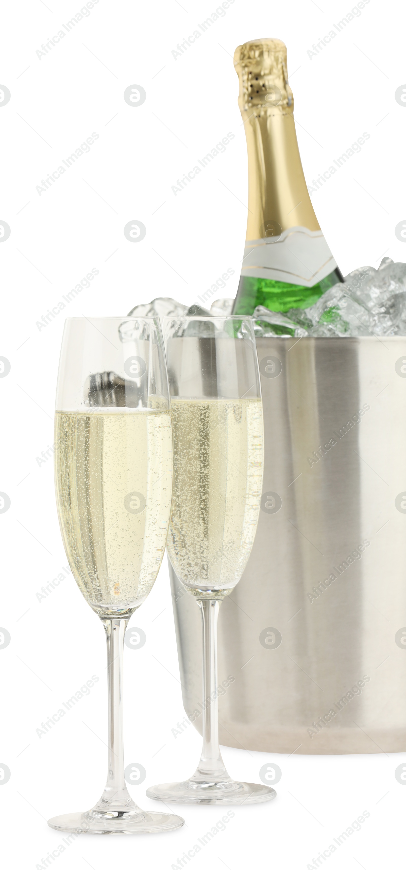 Photo of Champagne in glasses and ice bucket with bottle isolated on white