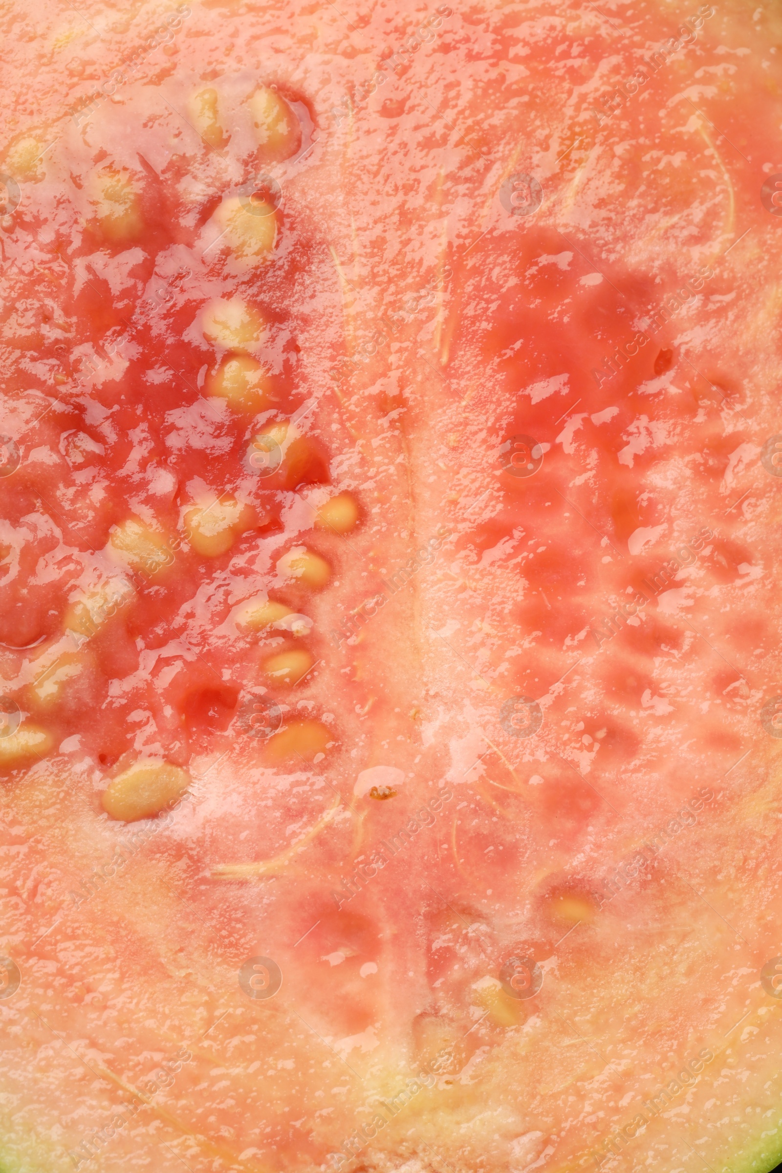 Photo of Juicy guava fruit with seeds as background, top view