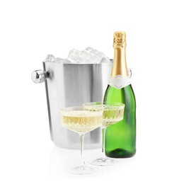 Champagne in glasses, bottle and ice bucket isolated on white