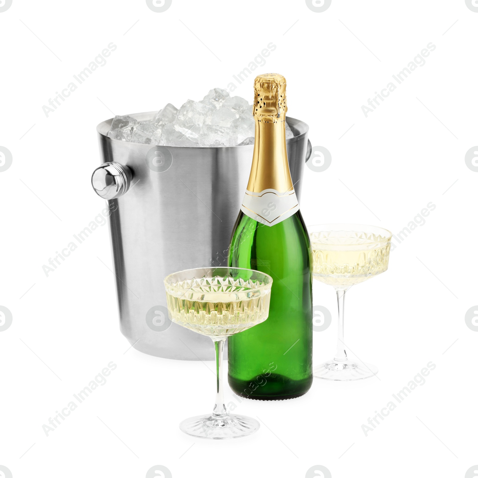 Photo of Champagne in glasses, bottle and ice bucket isolated on white