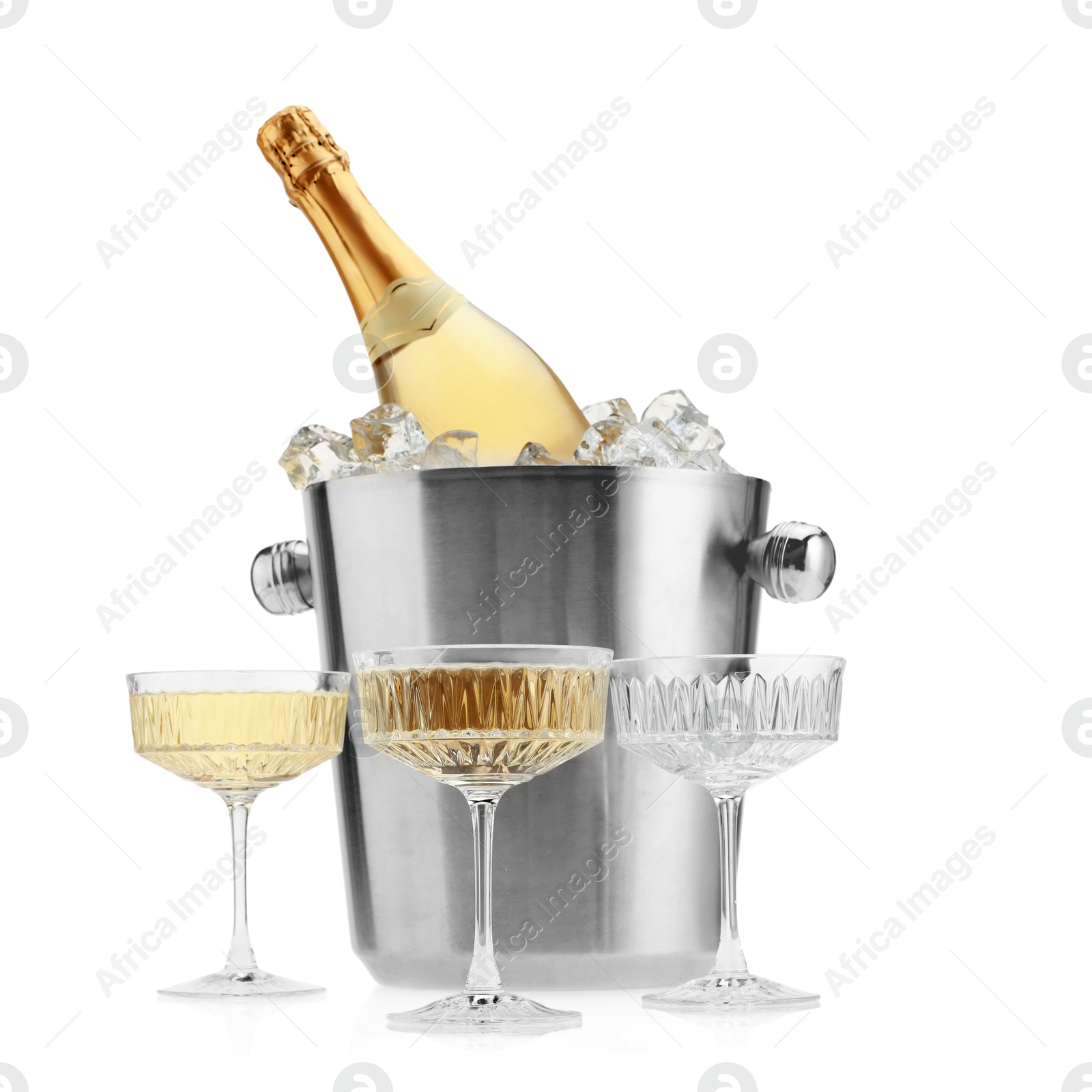 Photo of Champagne in glasses and ice bucket with bottle isolated on white