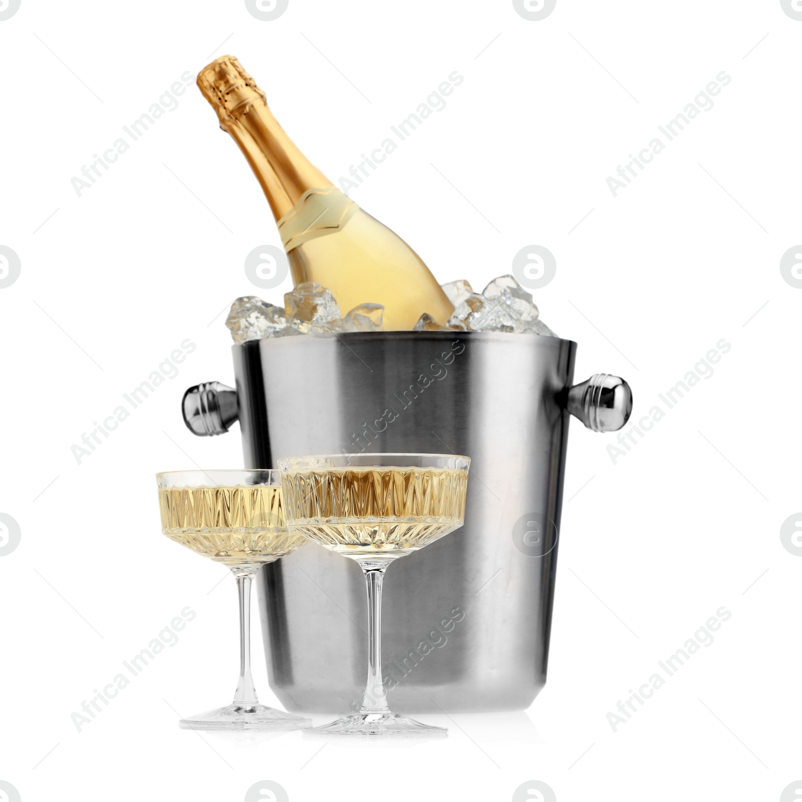 Photo of Champagne in glasses and ice bucket with bottle isolated on white