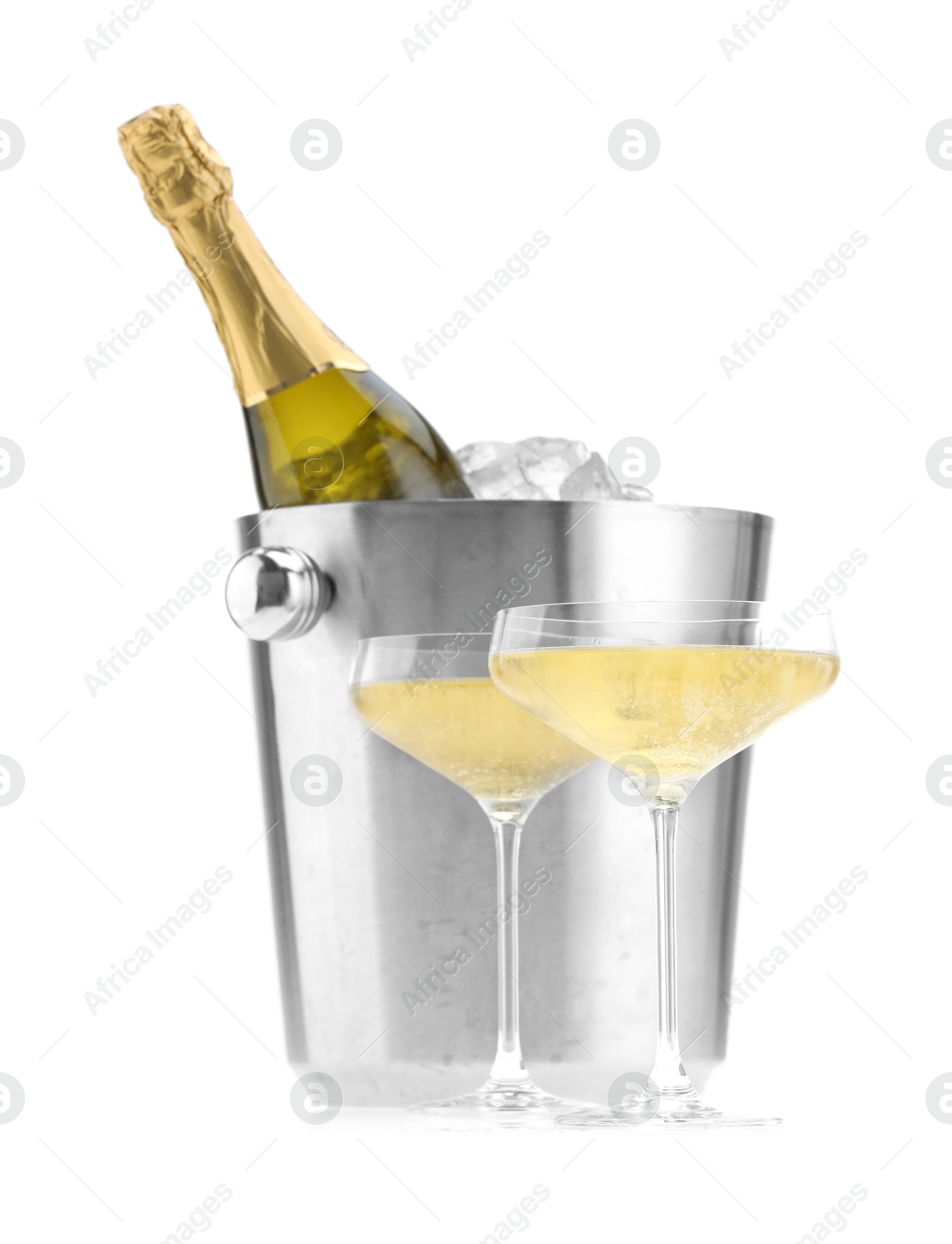 Photo of Champagne in glasses and ice bucket with bottle isolated on white