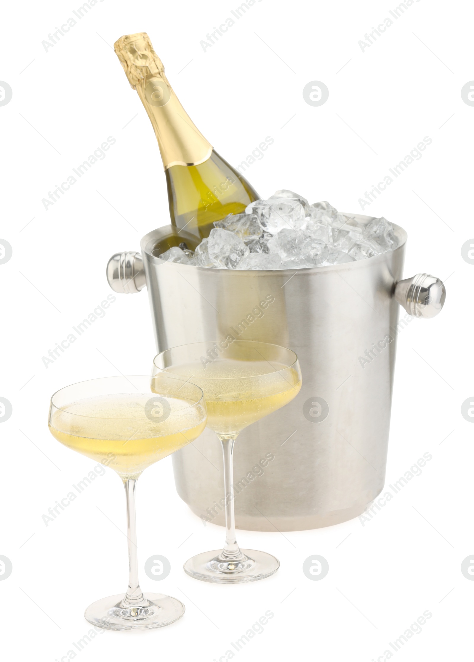 Photo of Champagne in glasses and ice bucket with bottle isolated on white