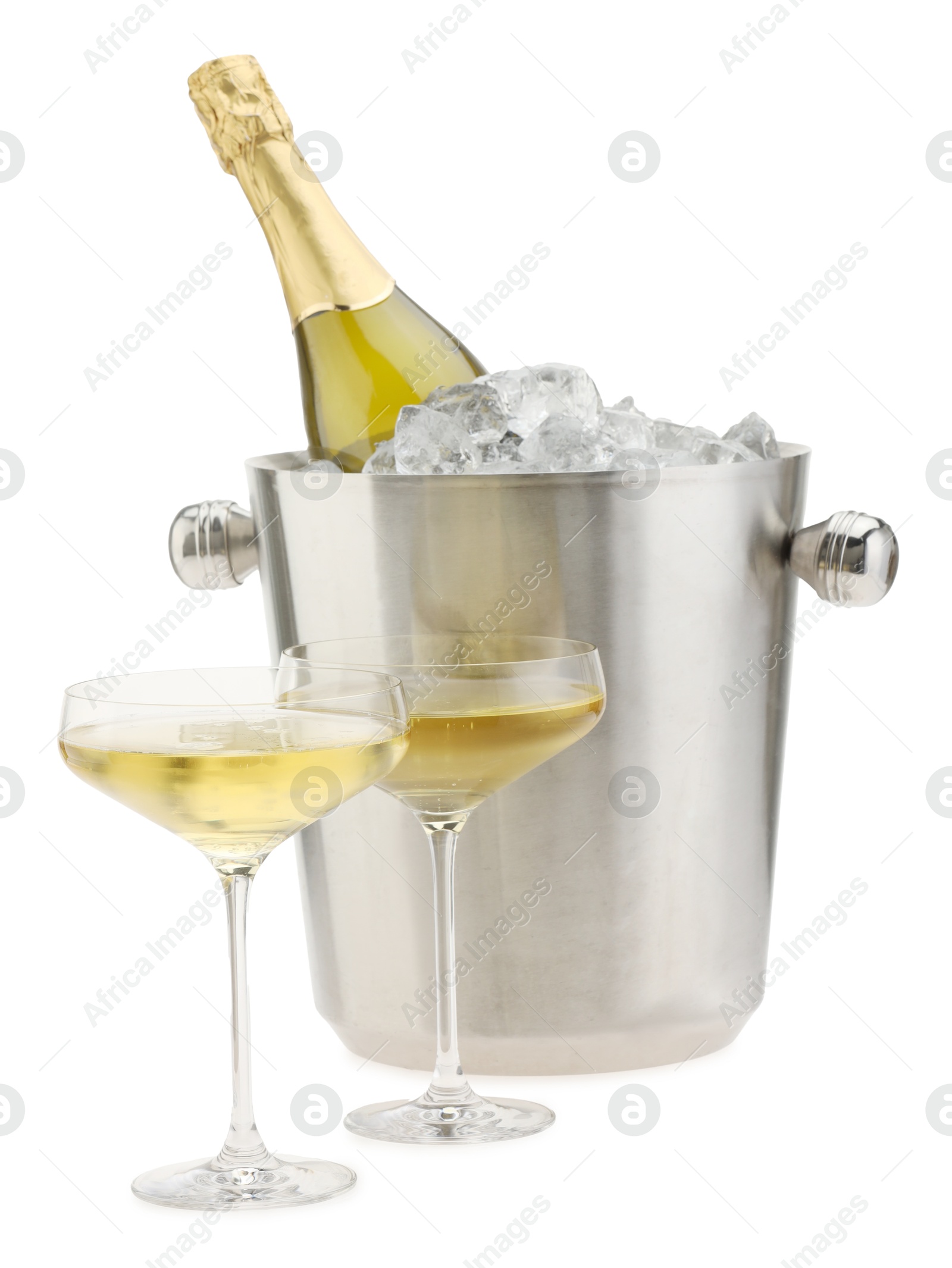 Photo of Champagne in glasses and ice bucket with bottle isolated on white