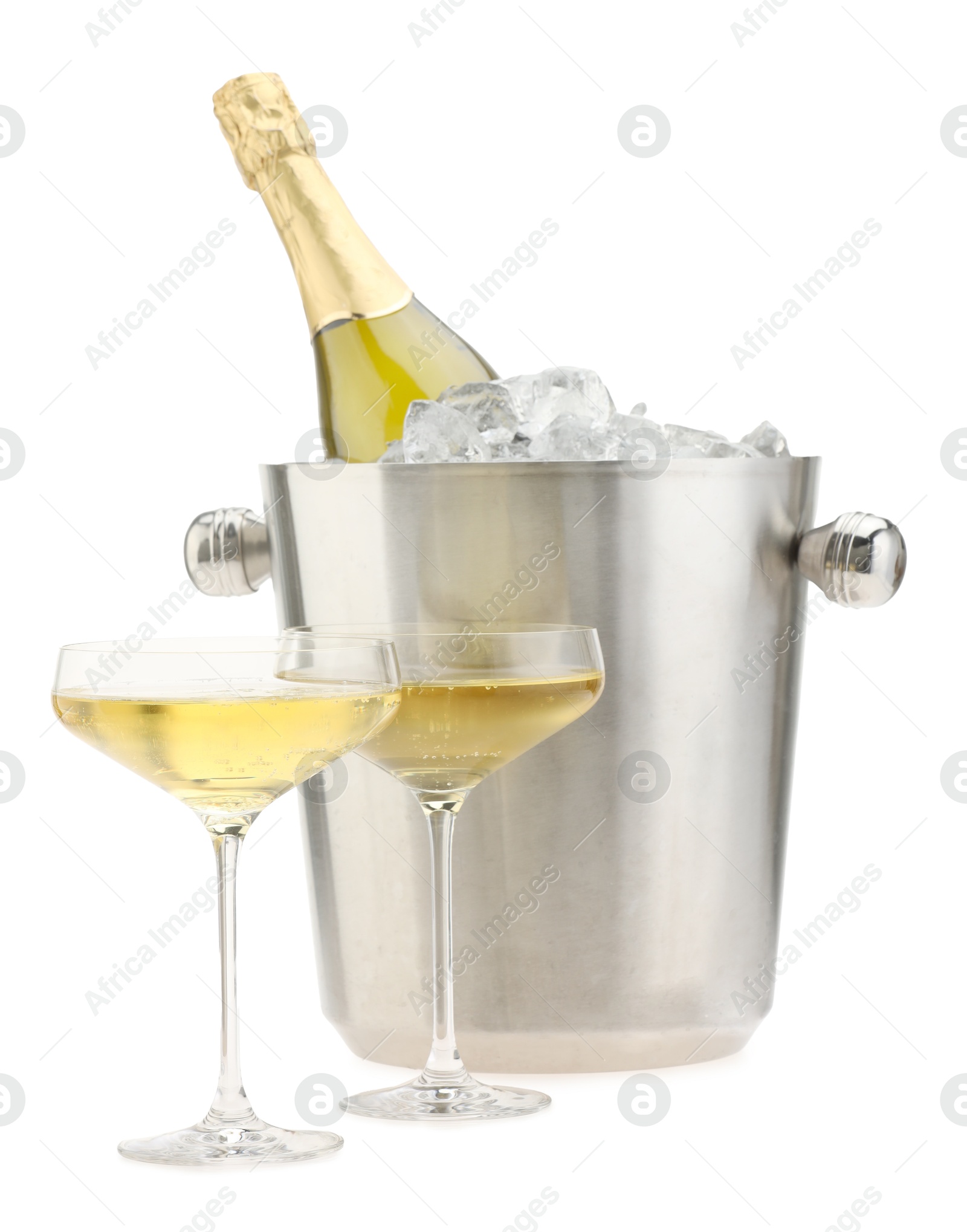 Photo of Champagne in glasses and ice bucket with bottle isolated on white