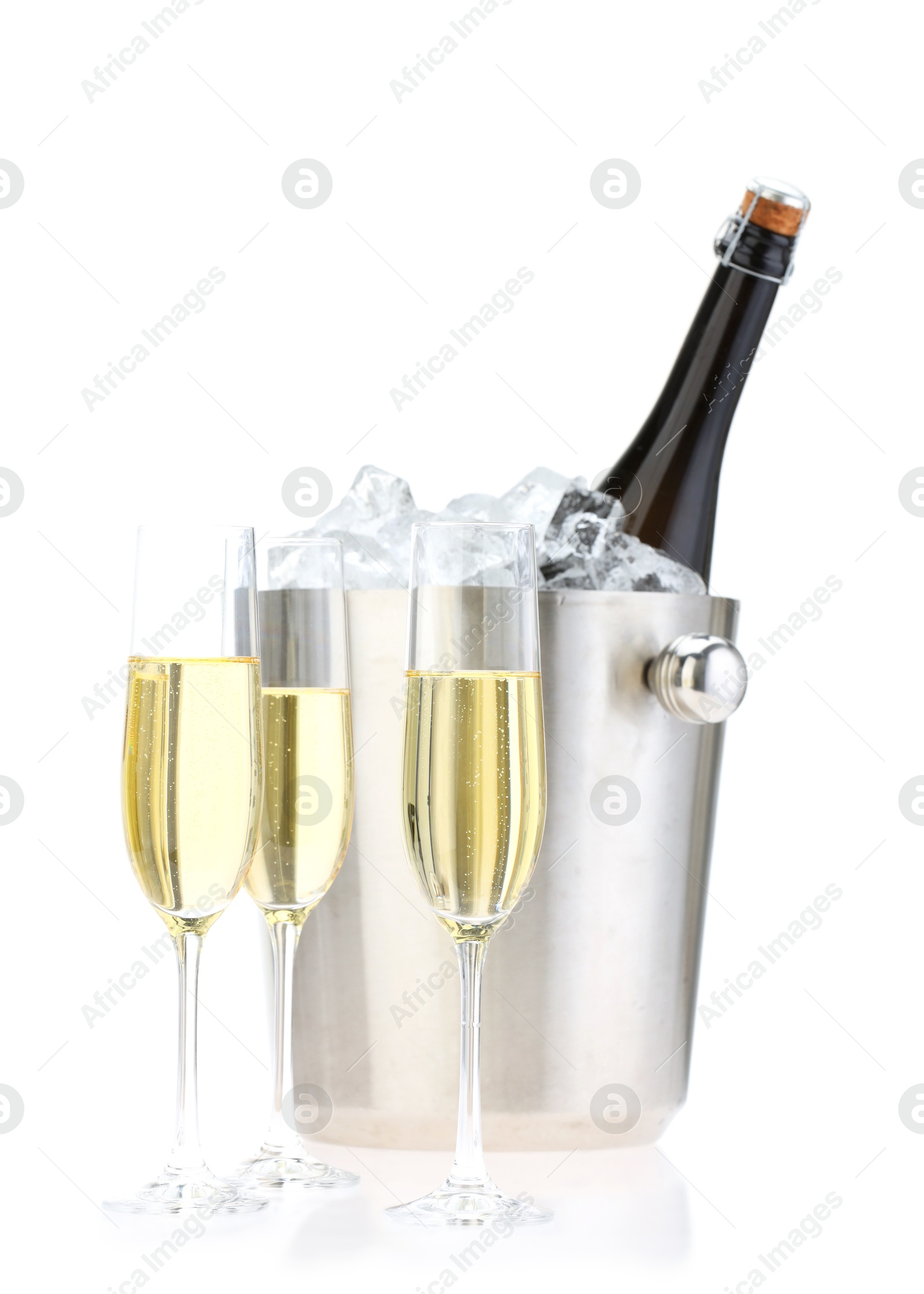 Photo of Champagne in glasses and ice bucket with bottle isolated on white