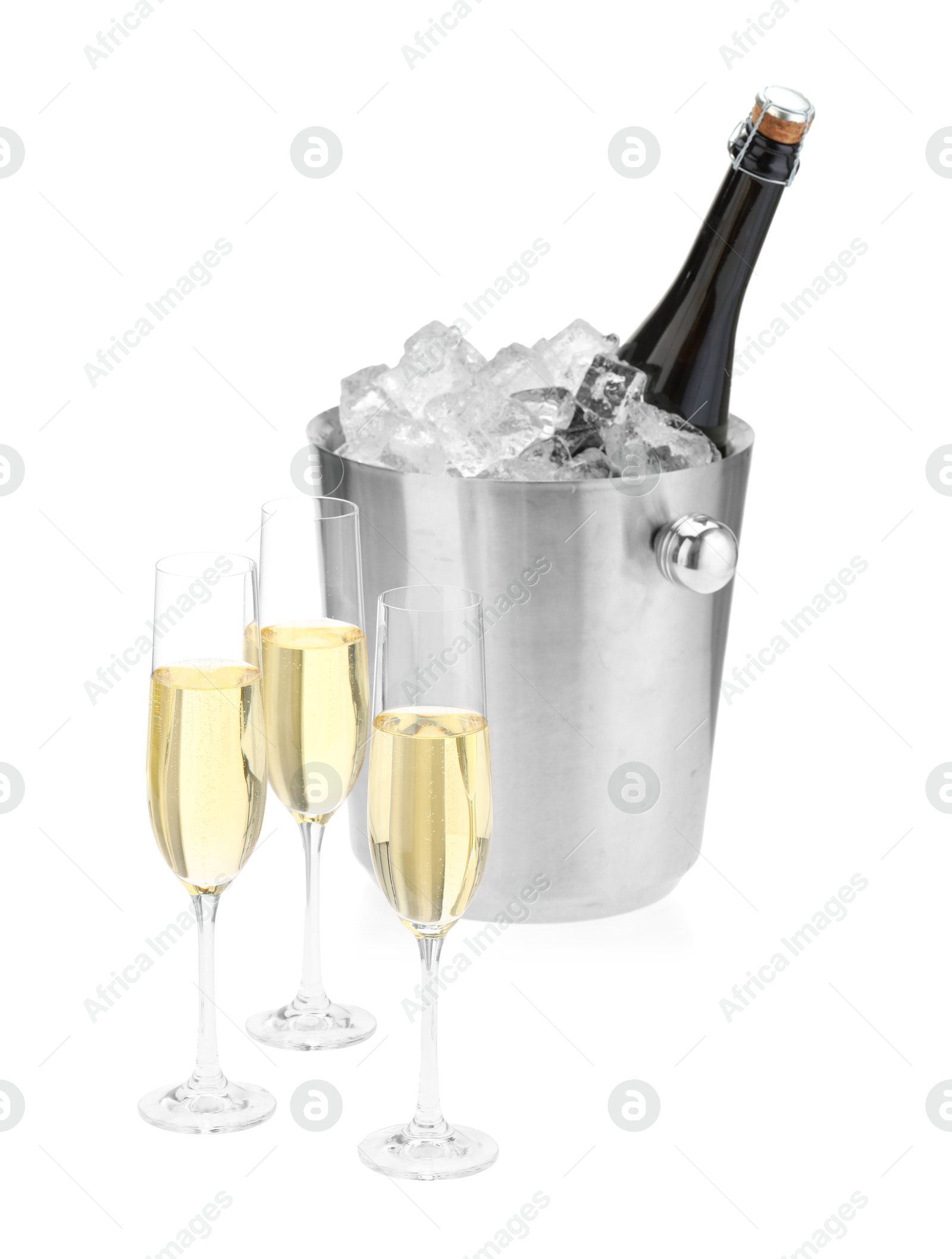 Photo of Champagne in glasses and ice bucket with bottle isolated on white