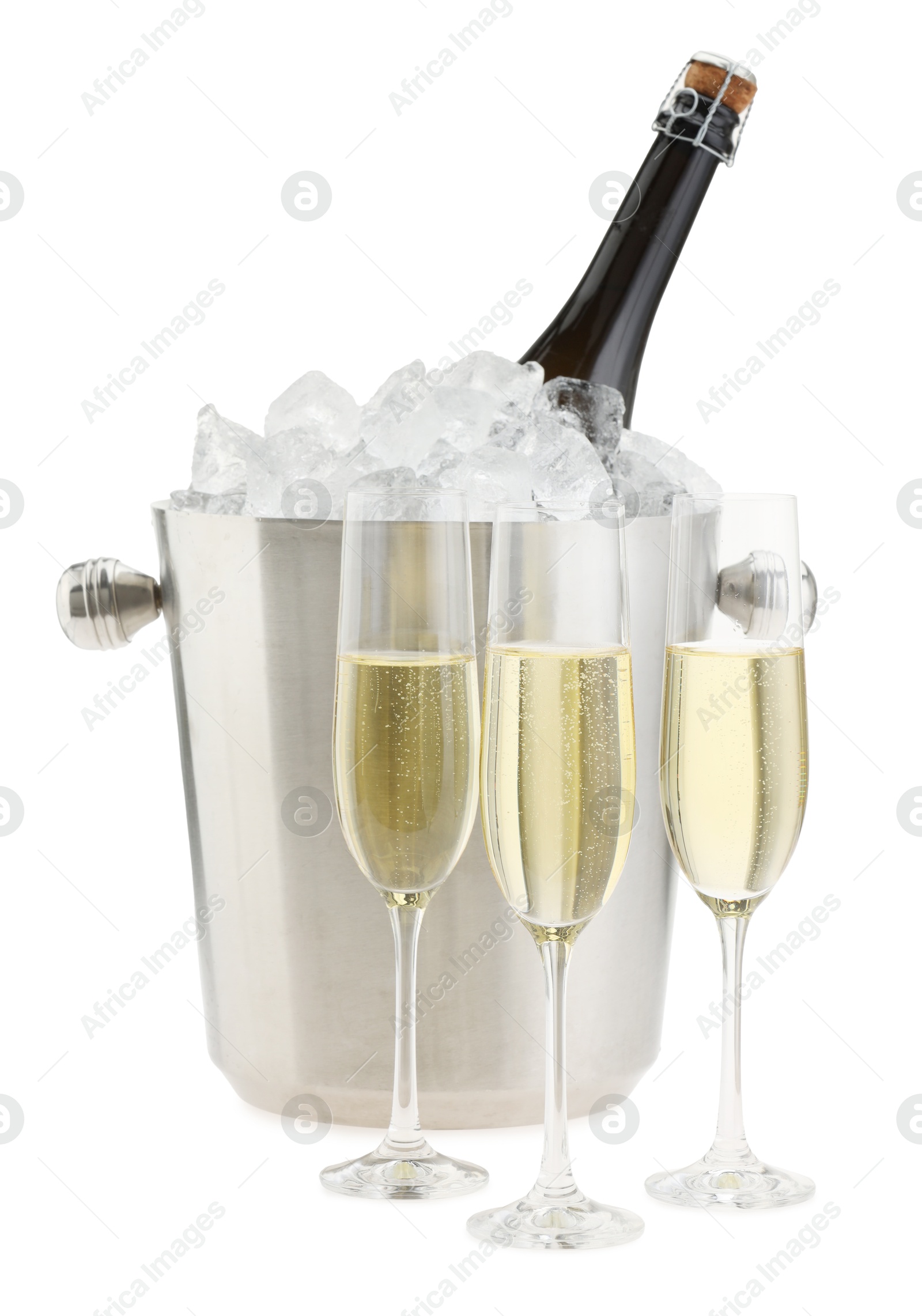 Photo of Champagne in glasses and ice bucket with bottle isolated on white