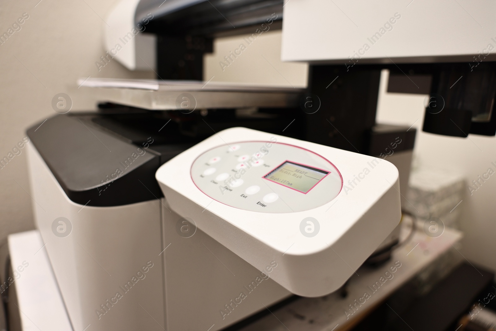 Photo of Modern printer in room, closeup. Printing equipment