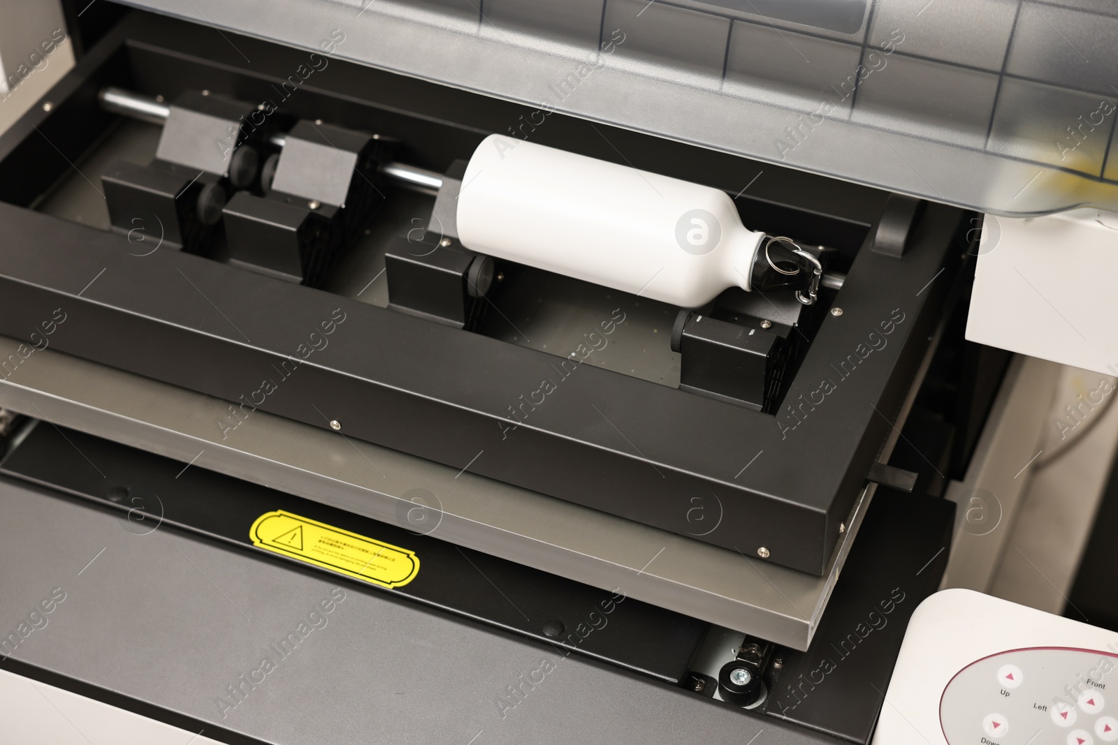 Photo of Modern printer and bottle with carabiner indoors, closeup