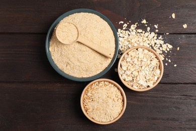 Photo of Oat bran, grains and flakes on wooden table, flat lay