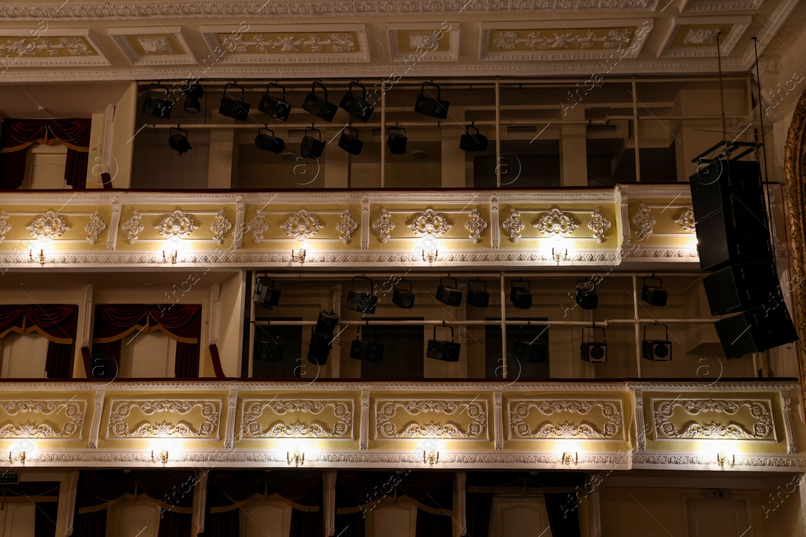 Photo of Balconies with vintage wall lamps and spotlights in theatre