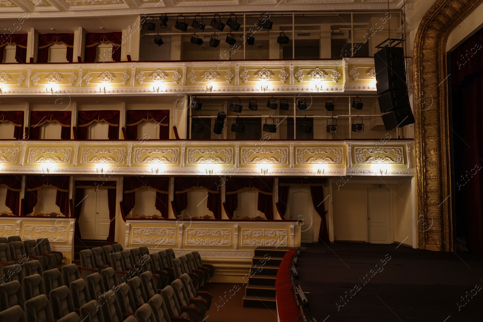 Photo of Theatre interior with stage and rows of comfortable seats