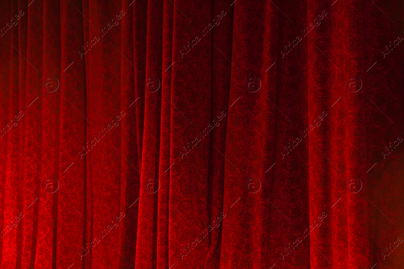 Photo of Elegant curtains in theatre as background, closeup