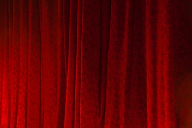 Photo of Elegant curtains in theatre as background, closeup