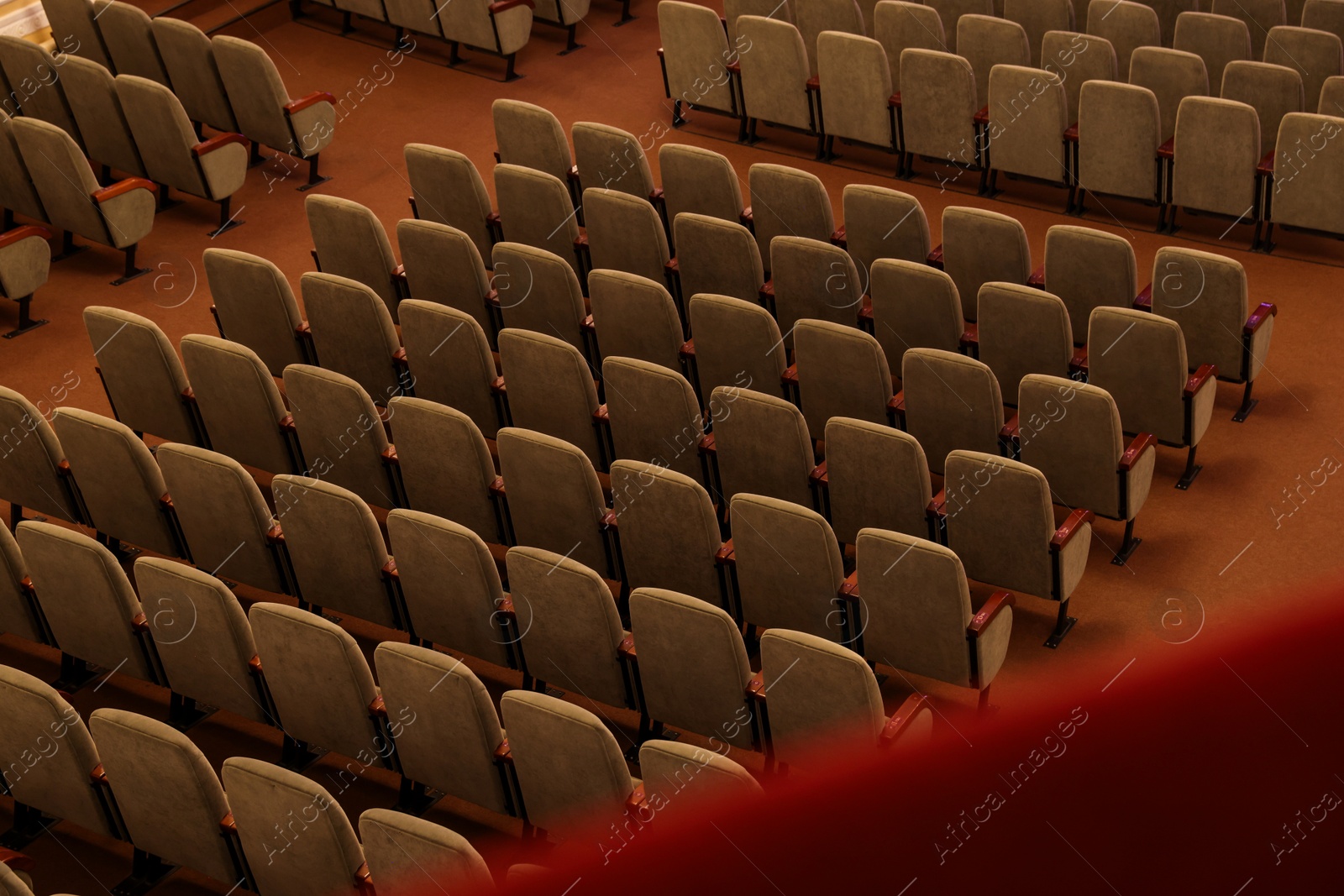 Photo of Rows of gray comfortable seats in theatre