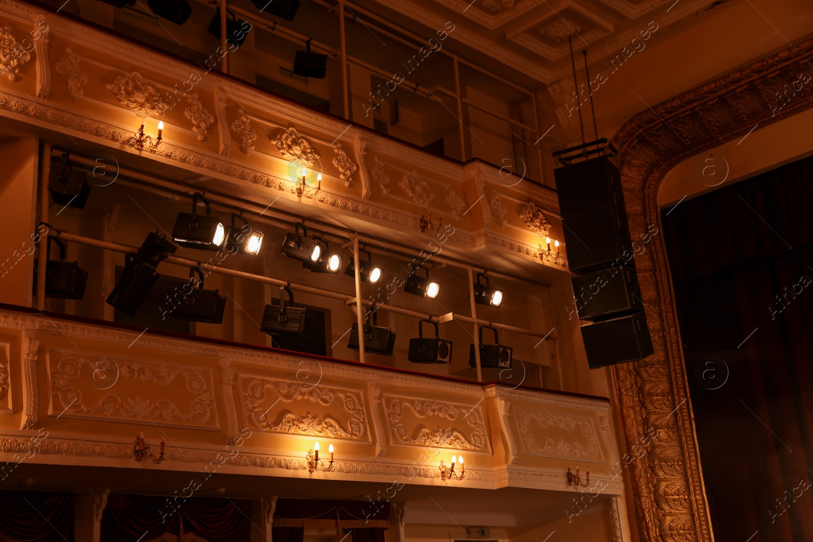 Photo of Professional spotlights and smoke in theatre, low angle view