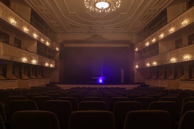 Photo of Theatre interior with stage and rows of comfortable seats