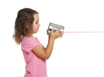 Photo of Girl using tin can telephone on white background