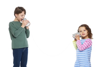 Photo of Boy and girl talking on tin can telephone against white background