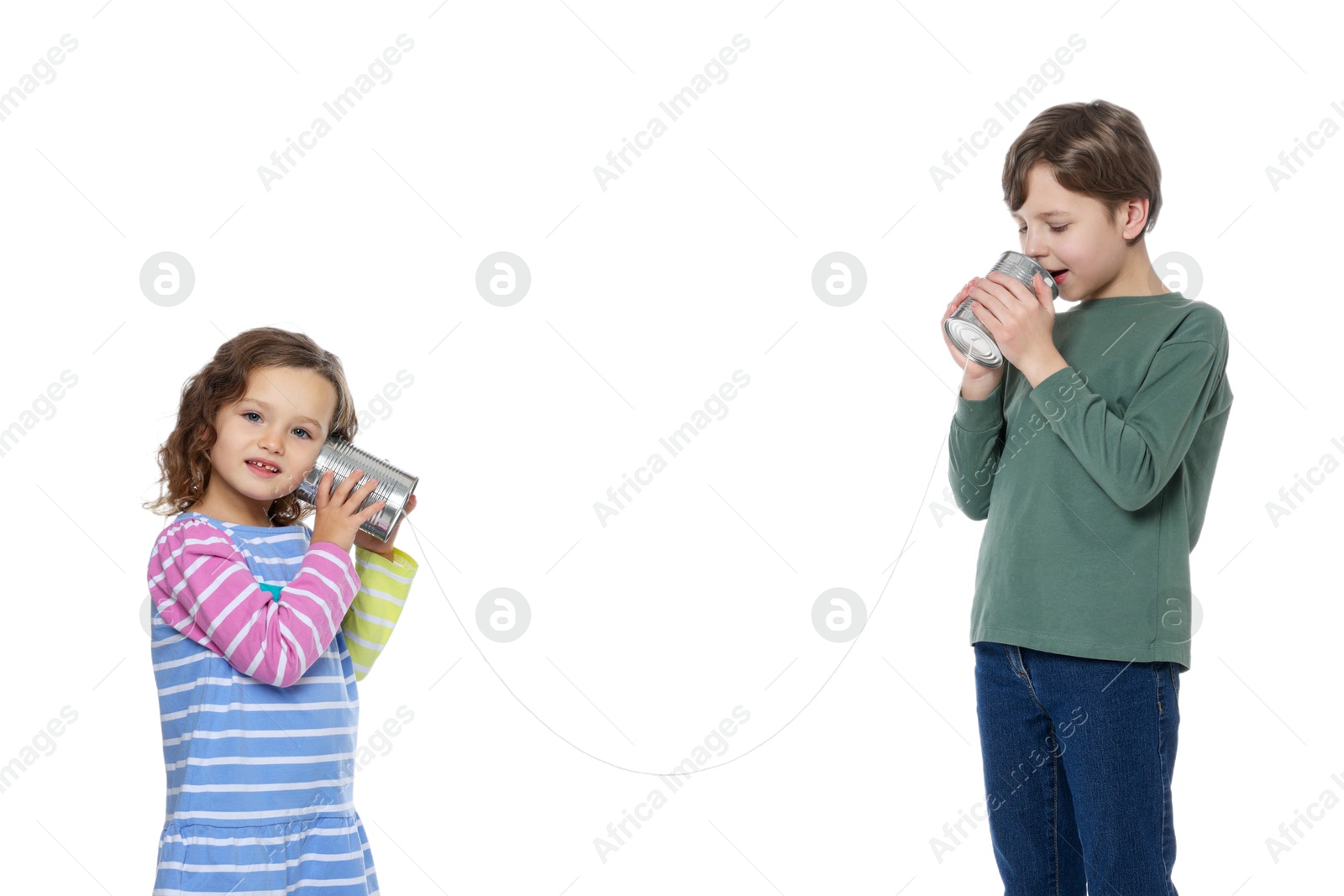 Photo of Boy and girl talking on tin can telephone against white background