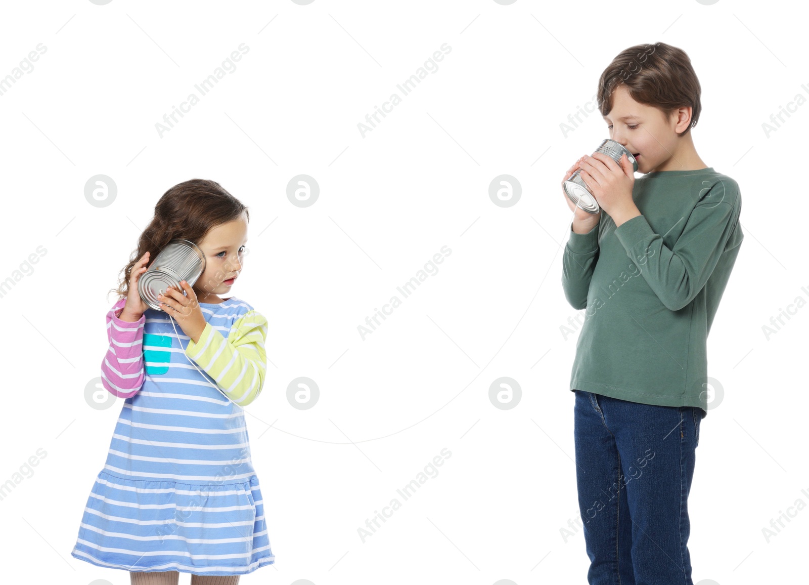 Photo of Boy and girl talking on tin can telephone against white background