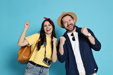 Tourism. Emotional couple on light blue background