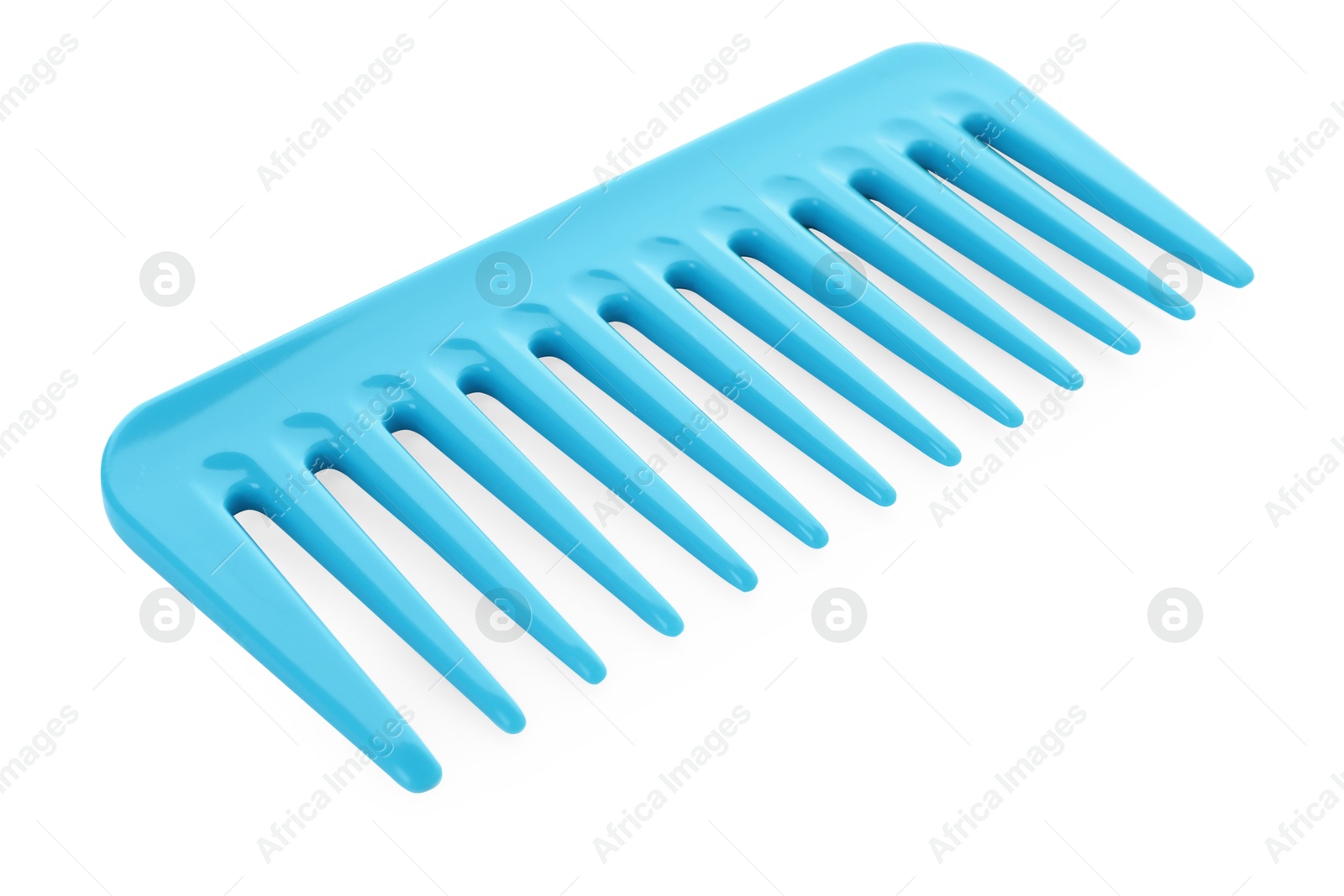 Photo of One light blue plastic comb isolated on white