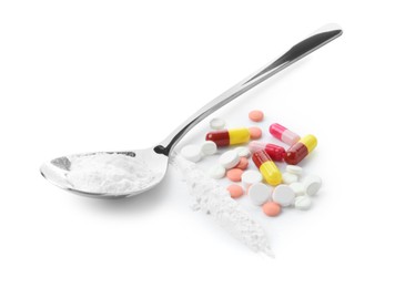 Photo of Drug addiction. Different pills and spoon with powder isolated on white