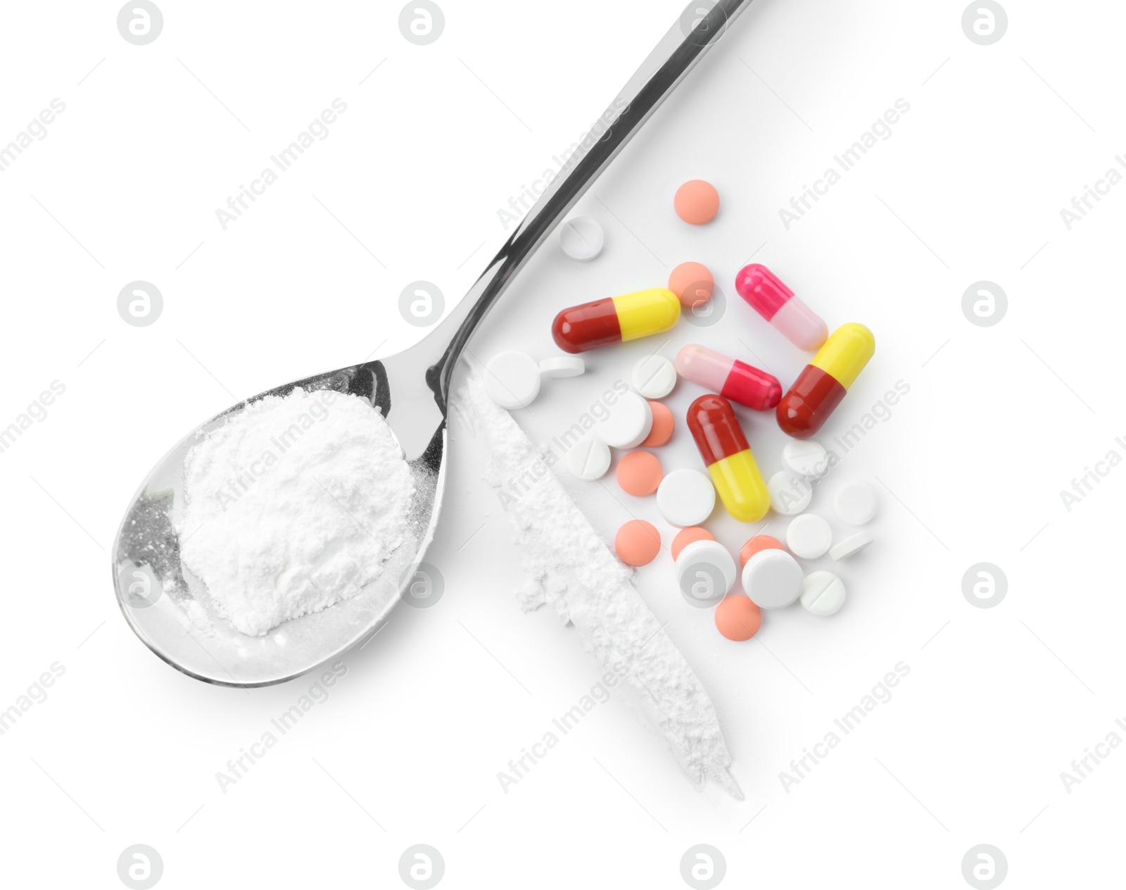 Photo of Drug addiction. Different pills and spoon with powder isolated on white, top view