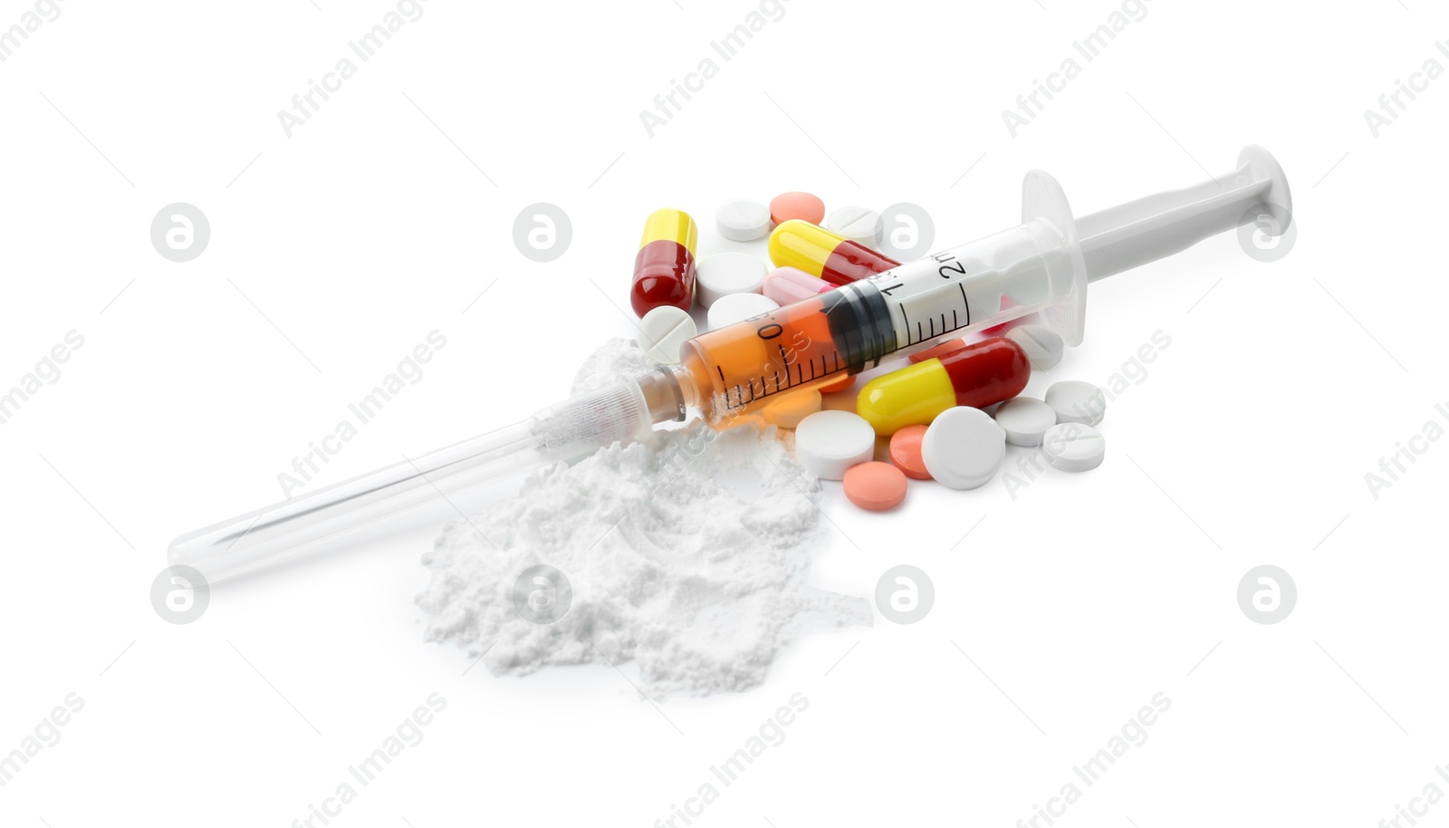 Photo of Drug addiction. Different pills, syringe and powder isolated on white