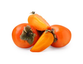 Photo of Whole and cut ripe persimmons isolated on white