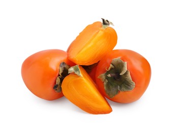 Whole and cut ripe persimmons isolated on white