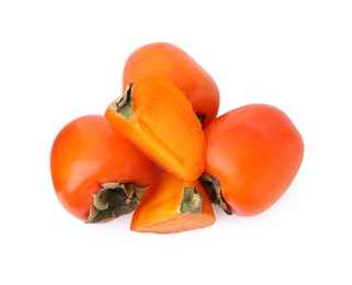 Photo of Whole and cut ripe persimmons isolated on white, top view