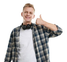 Photo of Happy man with headphones showing thumbs up on white background. Like gesture