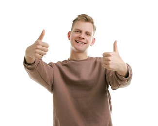 Photo of Happy man showing thumbs up on white background. Like gesture