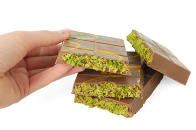 Photo of Woman with pieces of Dubai chocolate on white background, closeup