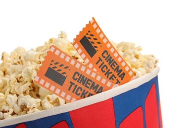 Photo of Tasty popcorn and movie tickets isolated on white