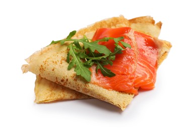 Photo of Delicious crepes with salmon and arugula isolated on white