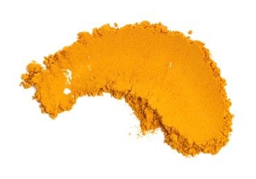 Photo of Heap of turmeric powder isolated on white, top view