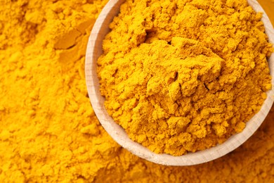 Photo of Turmeric powder in bowl on spice, top view