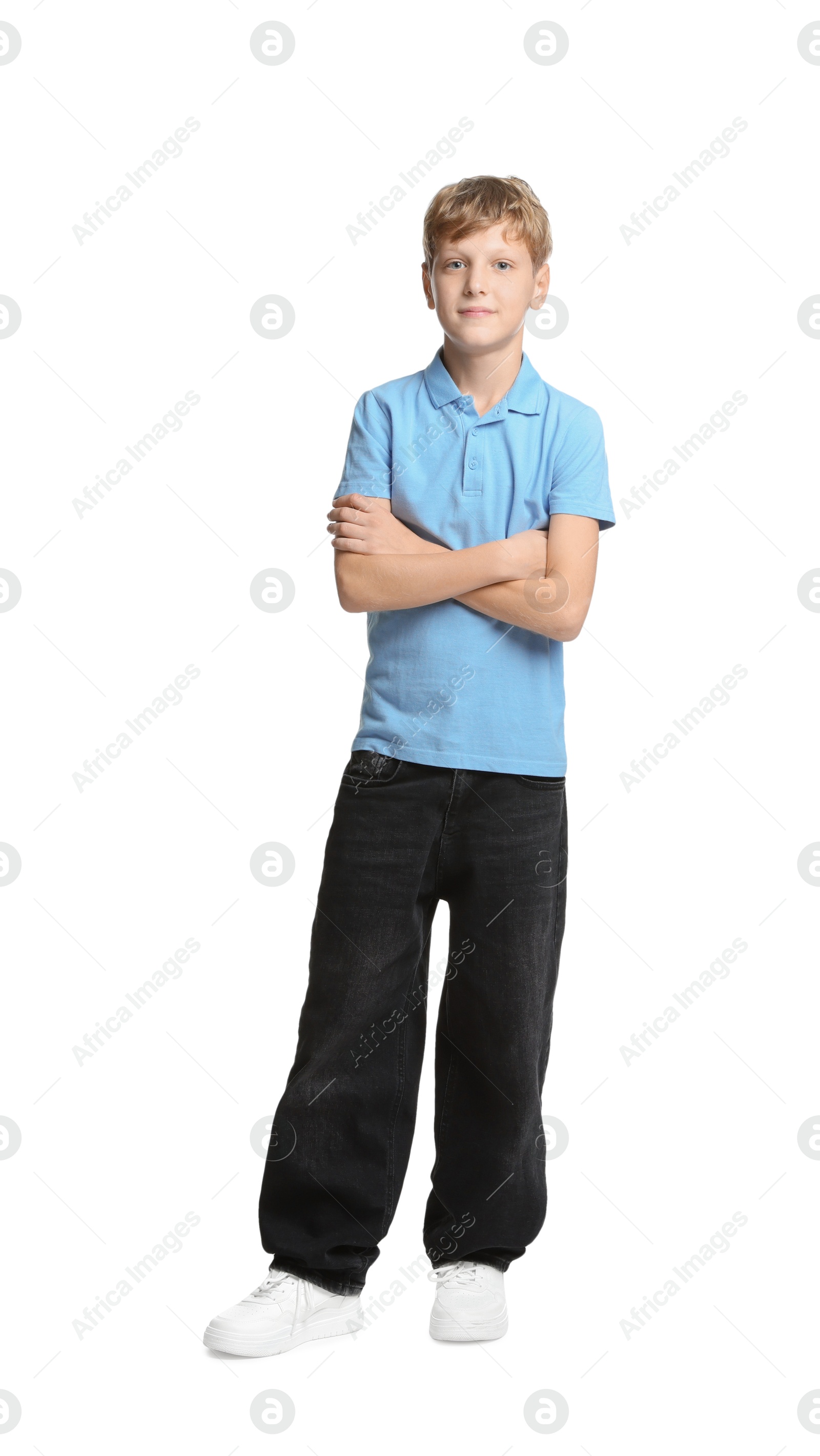 Photo of Full length portrait of teenage boy with crossed arms on white background