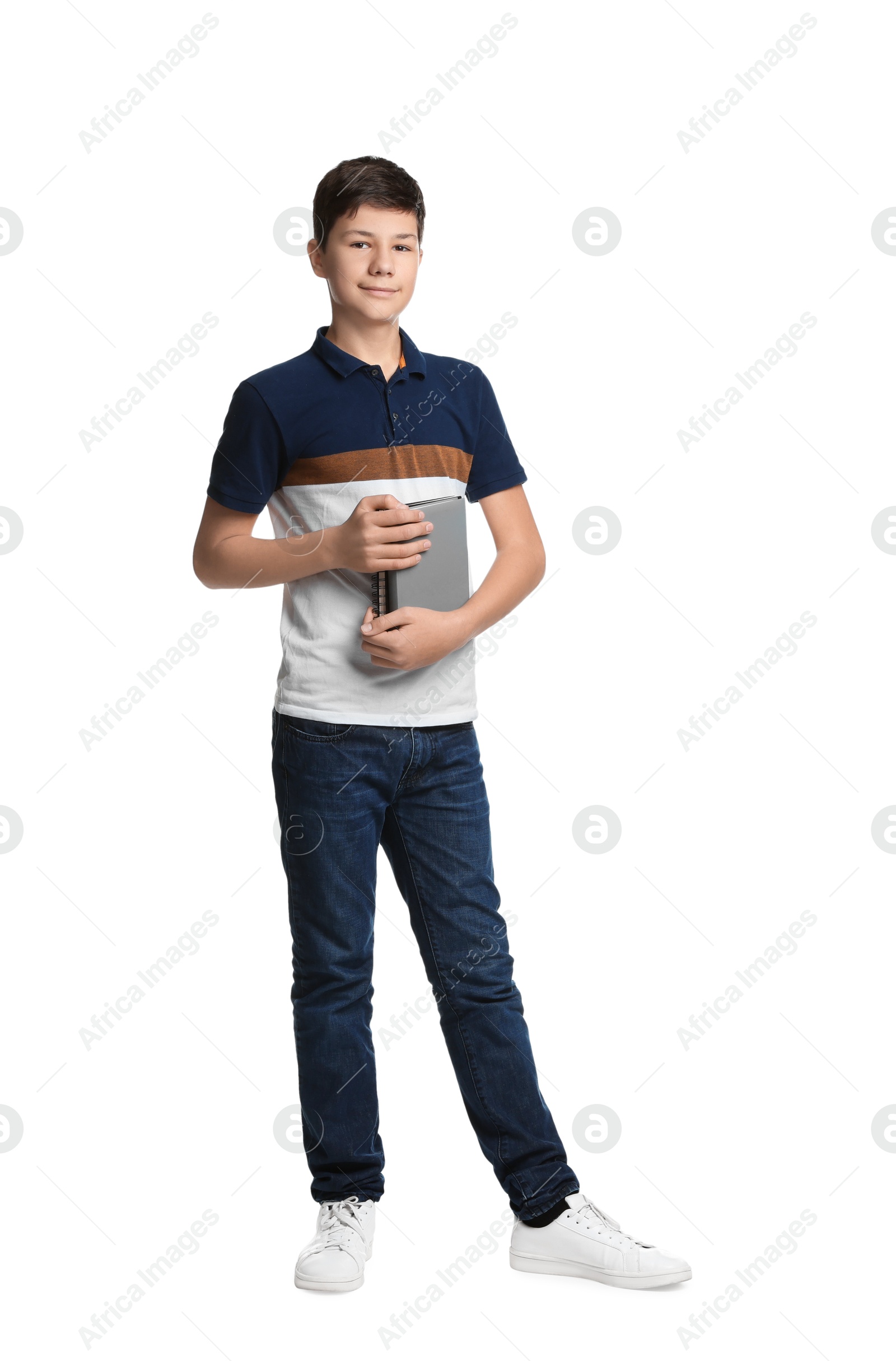 Photo of Full length portrait of teenage boy with books on white background