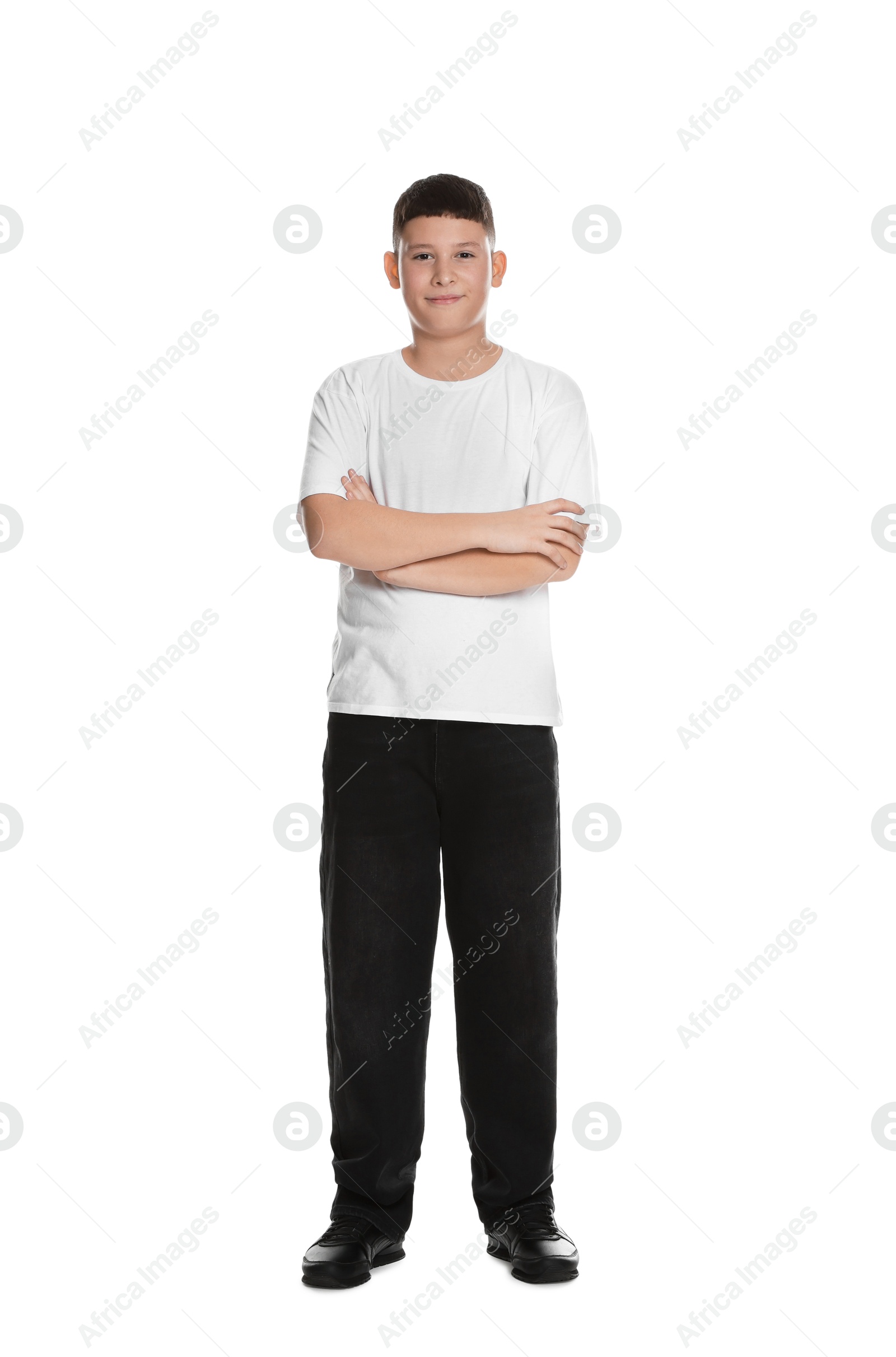 Photo of Full length portrait of teenage boy with crossed arms on white background