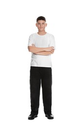 Photo of Full length portrait of teenage boy with crossed arms on white background