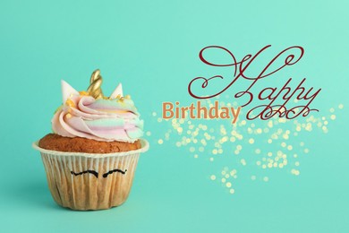 Image of Happy Birthday greeting card. Cute sweet unicorn cupcake on turquoise background