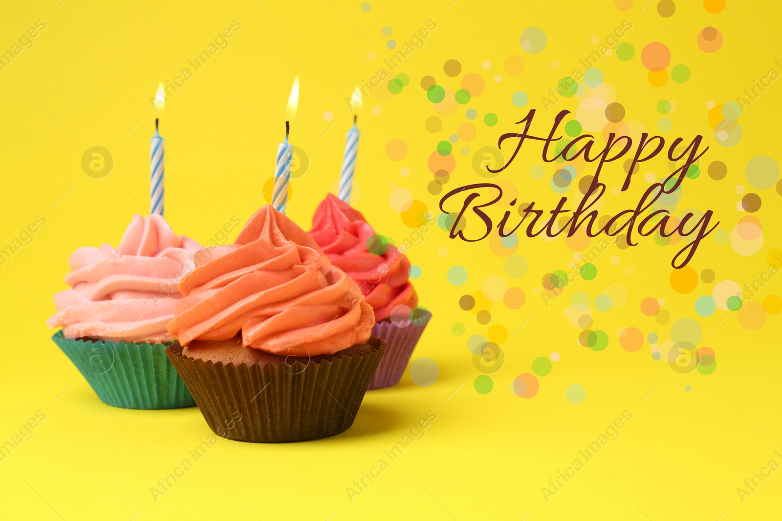 Image of Happy Birthday greeting card. Sweet cupcakes with burning candles on yellow background