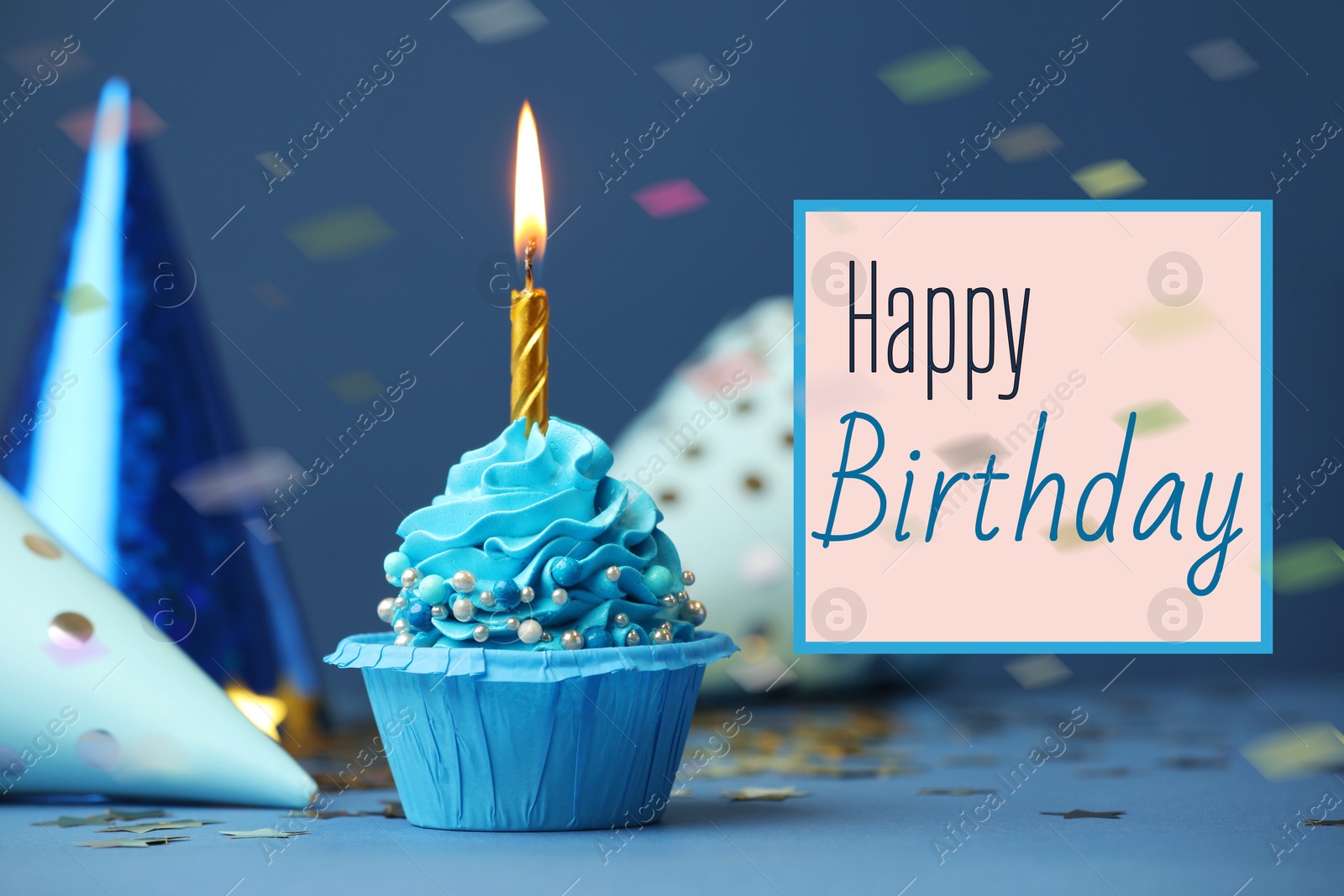 Image of Happy Birthday greeting card. Sweet cupcake with burning candle on blue background